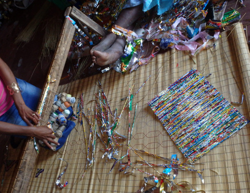 a Mat Weaving Board (Loom?) is being set up.